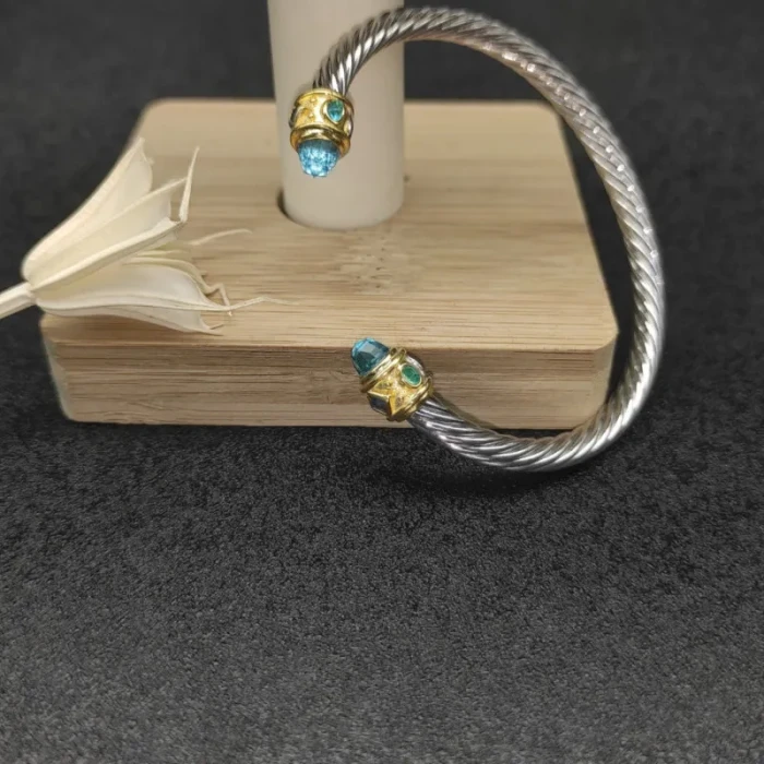 David Yurman 5mm Gold Cable Bracelet with Faceted Edge Design and Blue Diamonds