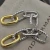 David Yurman Gold and Silver Cable Twist Hoop Earrings with Clasp Closure